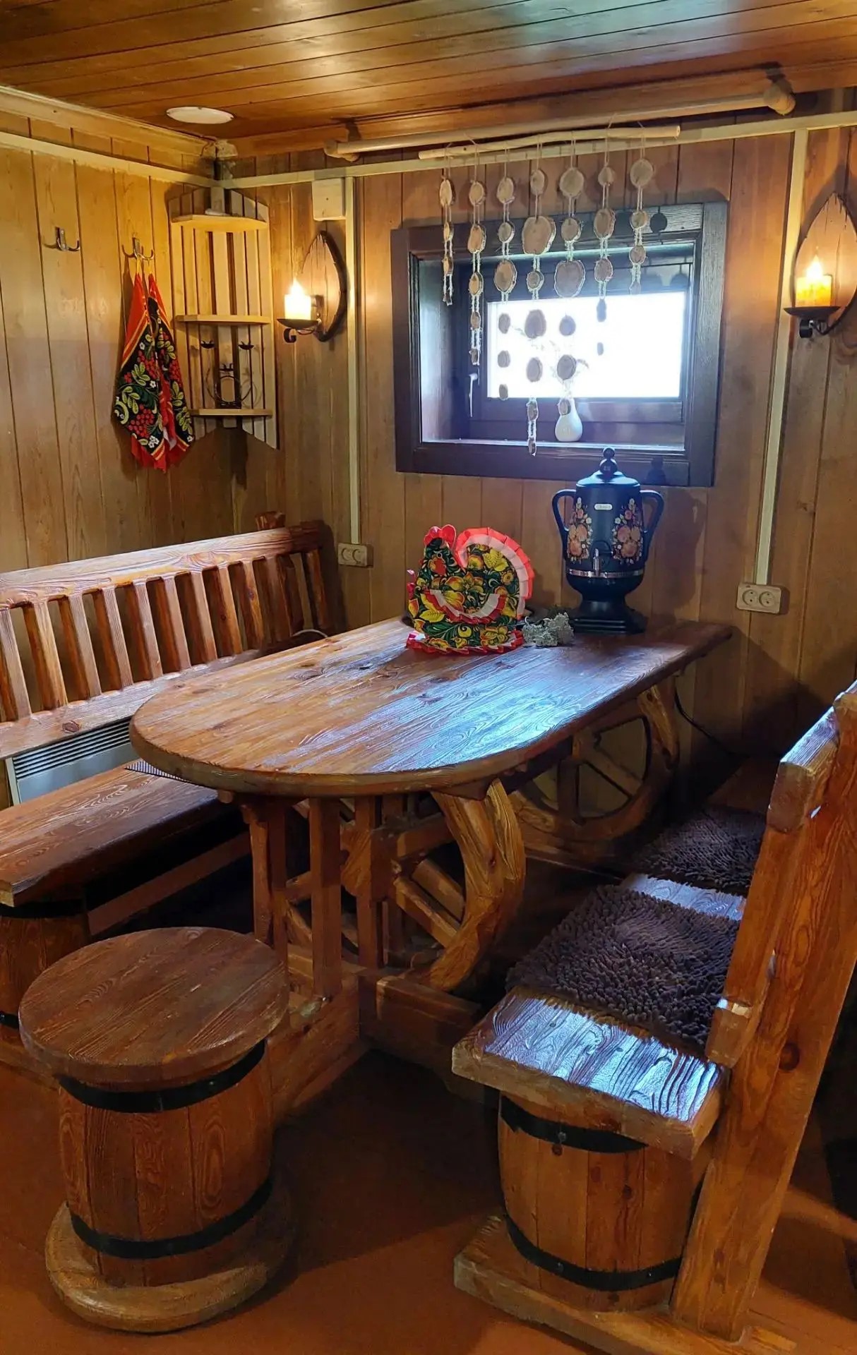 Cozy wooden dining area with furniture and a window.